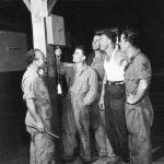 POWs Looking at Camp Clock