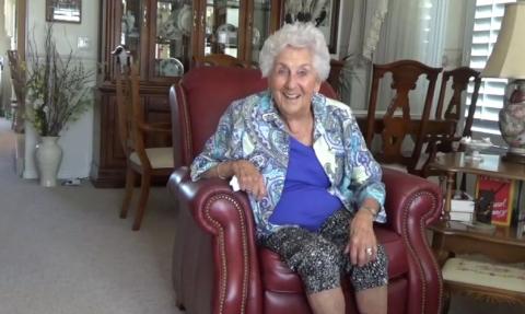 An image of Evelyn Hoogland, sitting in a leather chair, in her home, on July 18, 2017