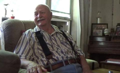 An image of JC Robinson sitting in his home on July 6, 2017