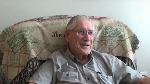 An image of Lee Foster sitting in a chair, in his home, on August 21, 2017