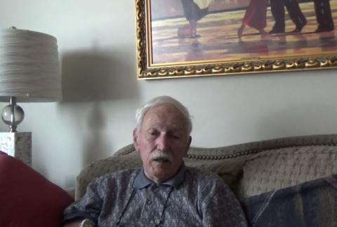 An image of Donald Kingsly, sitting on a couch, in his home, on July 11, 2017