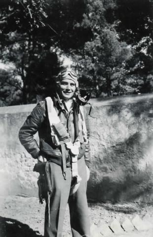 A black and white image of Kay Stowell dressed in pilot's uniform, taken circa 1940s