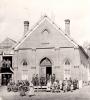 group of people standing in front of church building