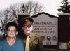 An image of Addie Blodgett (Left) and Earl Blodgett (Right) standing in front of a sign titled, "Selfridge Joint Military Community Michigan Air National Guard" 