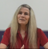 A still image of Cindy Simone during her oral history interview on August 6, 2019